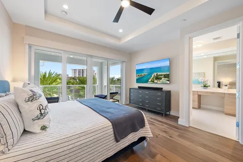a bathroom with a double vanity sink mirror and toilet