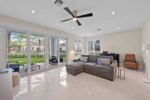 a bathroom with a shower sink vanity mirror and toilet