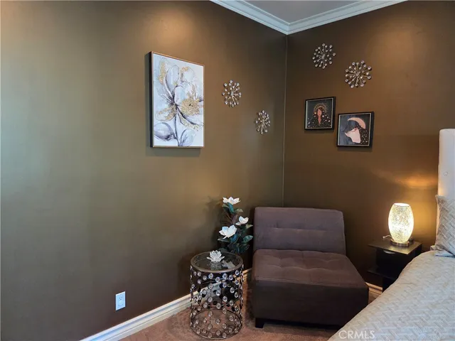 a living room with furniture and a lamp