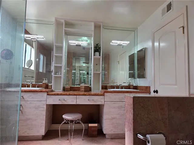 a dining hall with stainless steel appliances granite countertop a sink and a granite counter tops