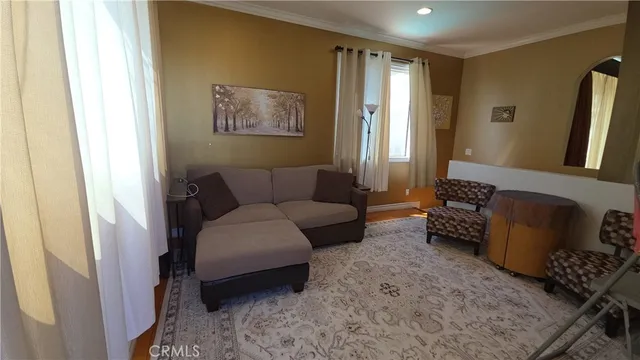 a living room with furniture and a rug
