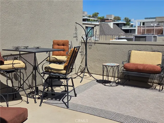 a view of a chairs and table on the terrace
