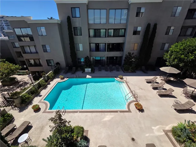an aerial view of a house with yard patio and swimming pool