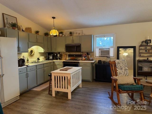 3319 Humphries Road Shelby, NC 28150 - Photo 21 of 41 a kitchen with a refrigerator a sink dishwasher a dining table and chairs with wooden floor
