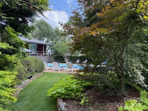 a view of a garden with a lake