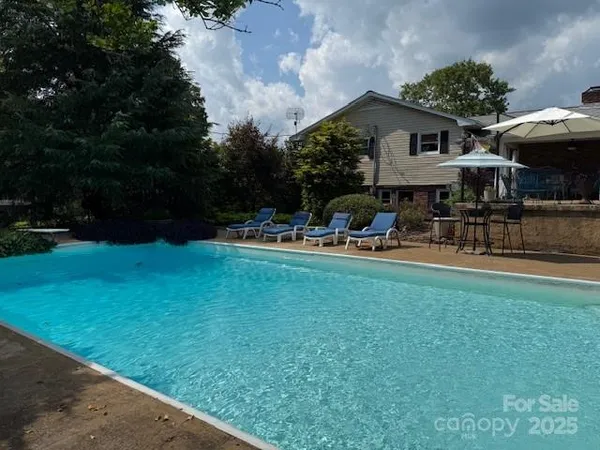 a backyard of a house with lots of green space