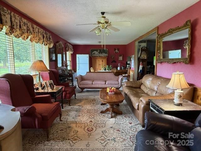 3319 Humphries Road Shelby, NC 28150 - Photo 5 of 41 a living room with furniture a rug and a chandelier