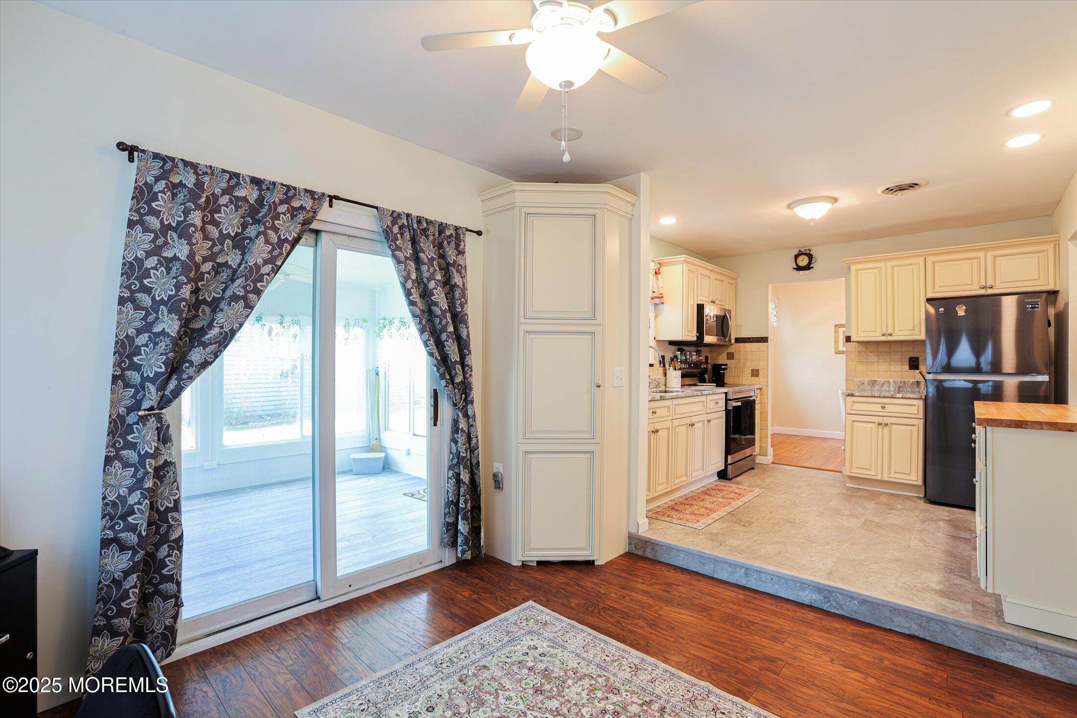 17 Churchill Road, Unit 71 Whiting, NJ 08759 - Photo 15 of 29 a kitchen with kitchen island a counter top space wooden floor and stainless steel appliances