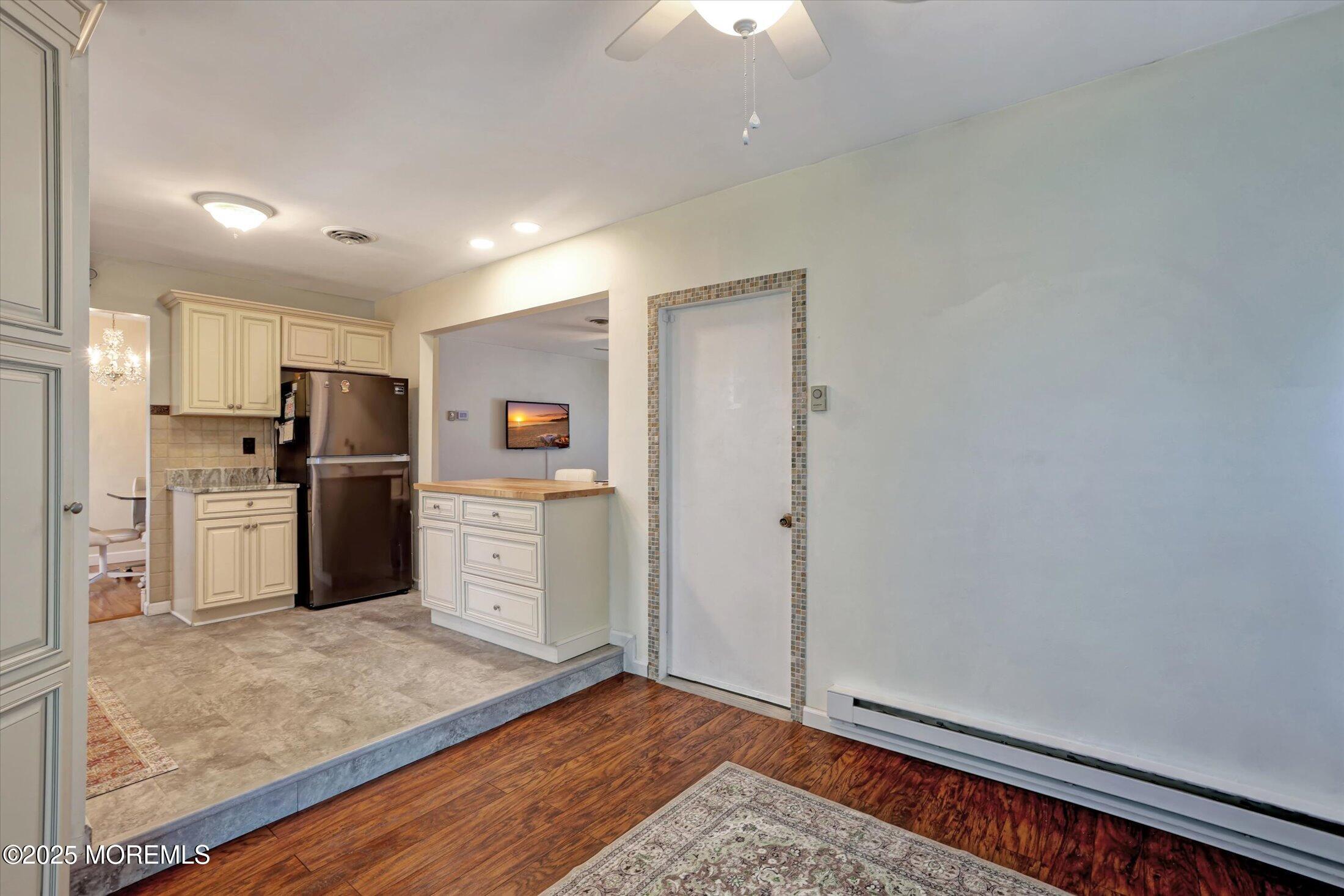 17 Churchill Road, Unit 71 Whiting, NJ 08759 - Photo 16 of 29 a kitchen with refrigerator cabinets and wooden floor