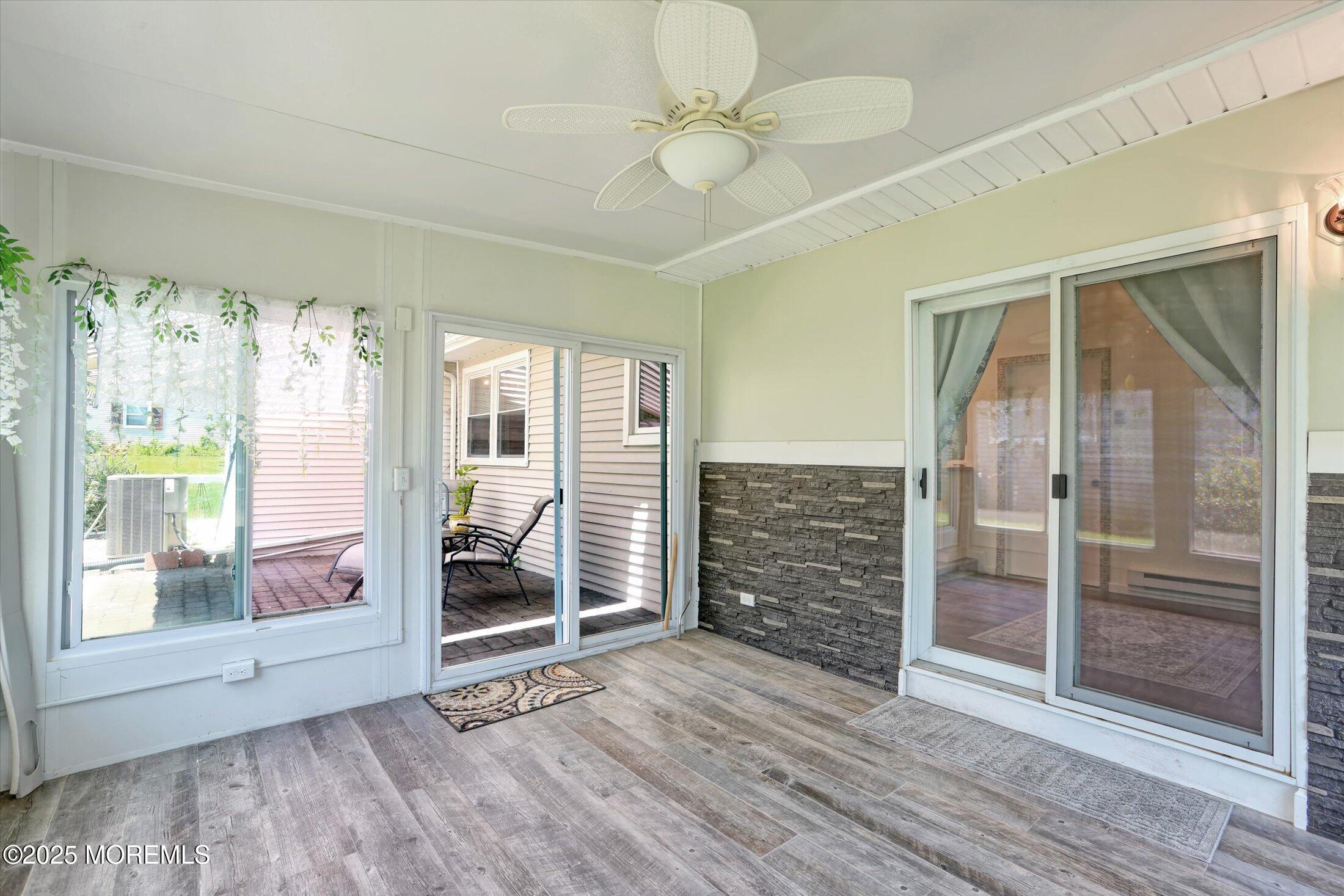 17 Churchill Road, Unit 71 Whiting, NJ 08759 - Photo 19 of 29 a view of an empty room with wooden floor and a window