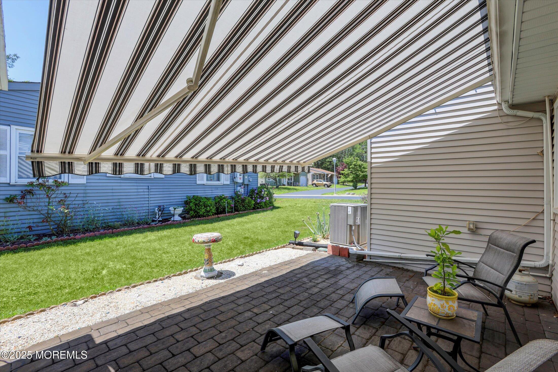 17 Churchill Road, Unit 71 Whiting, NJ 08759 - Photo 26 of 29 a backyard of a house with outdoor seating