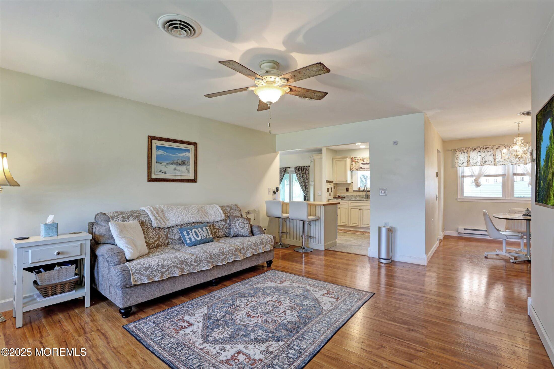 17 Churchill Road, Unit 71 Whiting, NJ 08759 - Photo 3 of 29 a living room with furniture and a wooden floor