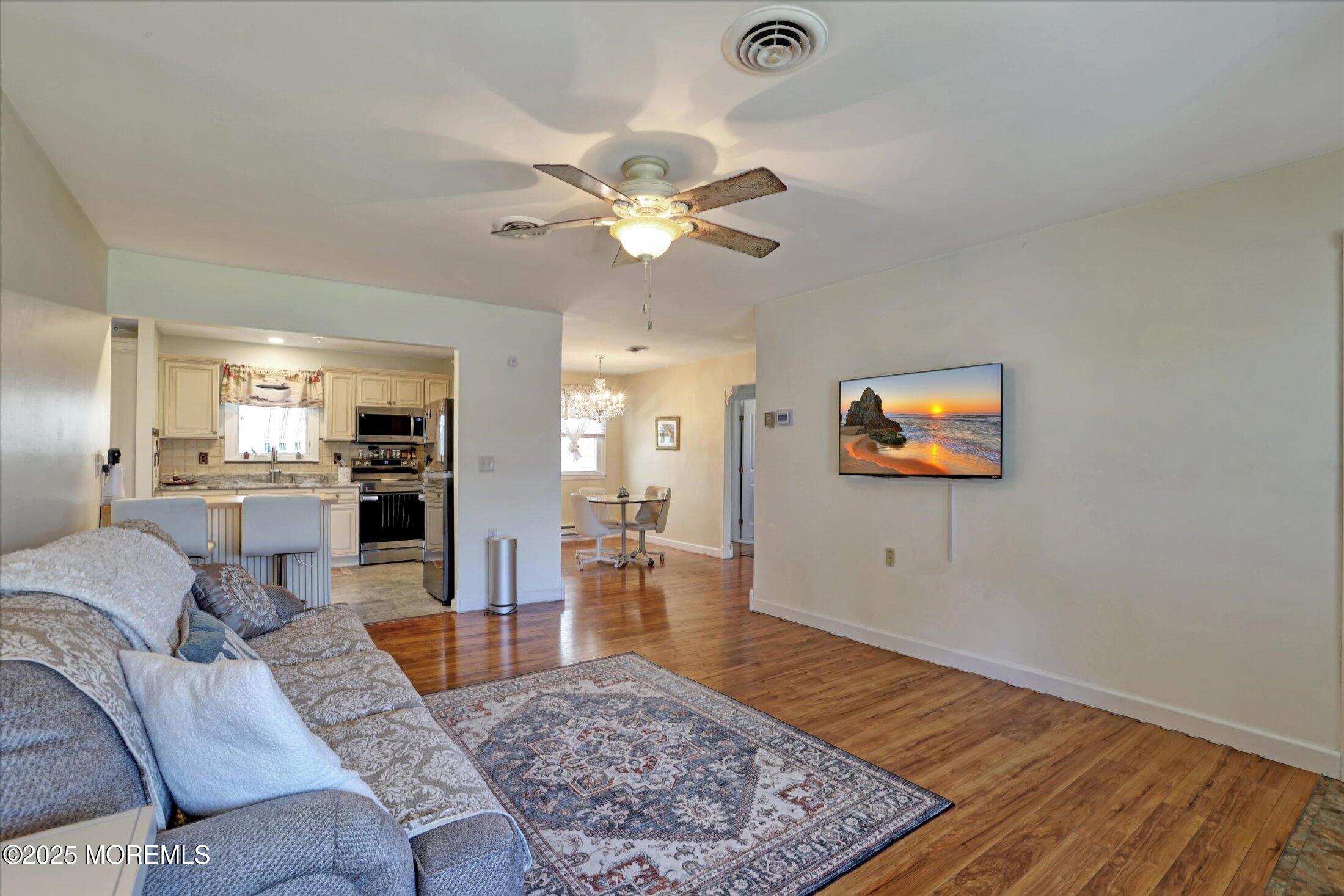 17 Churchill Road, Unit 71 Whiting, NJ 08759 - Photo 4 of 29 a living room with furniture and a rug