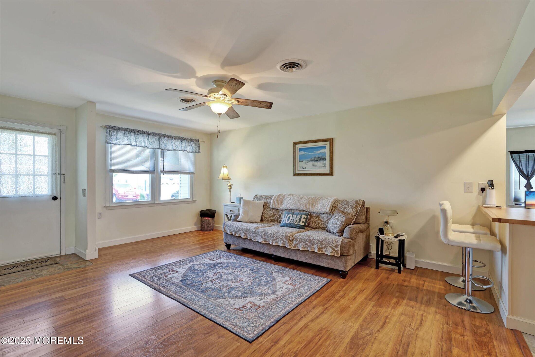 17 Churchill Road, Unit 71 Whiting, NJ 08759 - Photo 5 of 29 a living room with furniture and a wooden floor