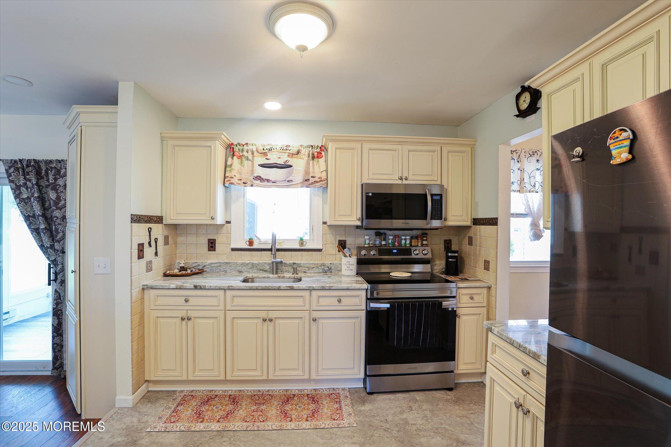 17 Churchill Road, Unit 71 Whiting, NJ 08759 - Photo 10 of 29 a kitchen with a sink stove and refrigerator