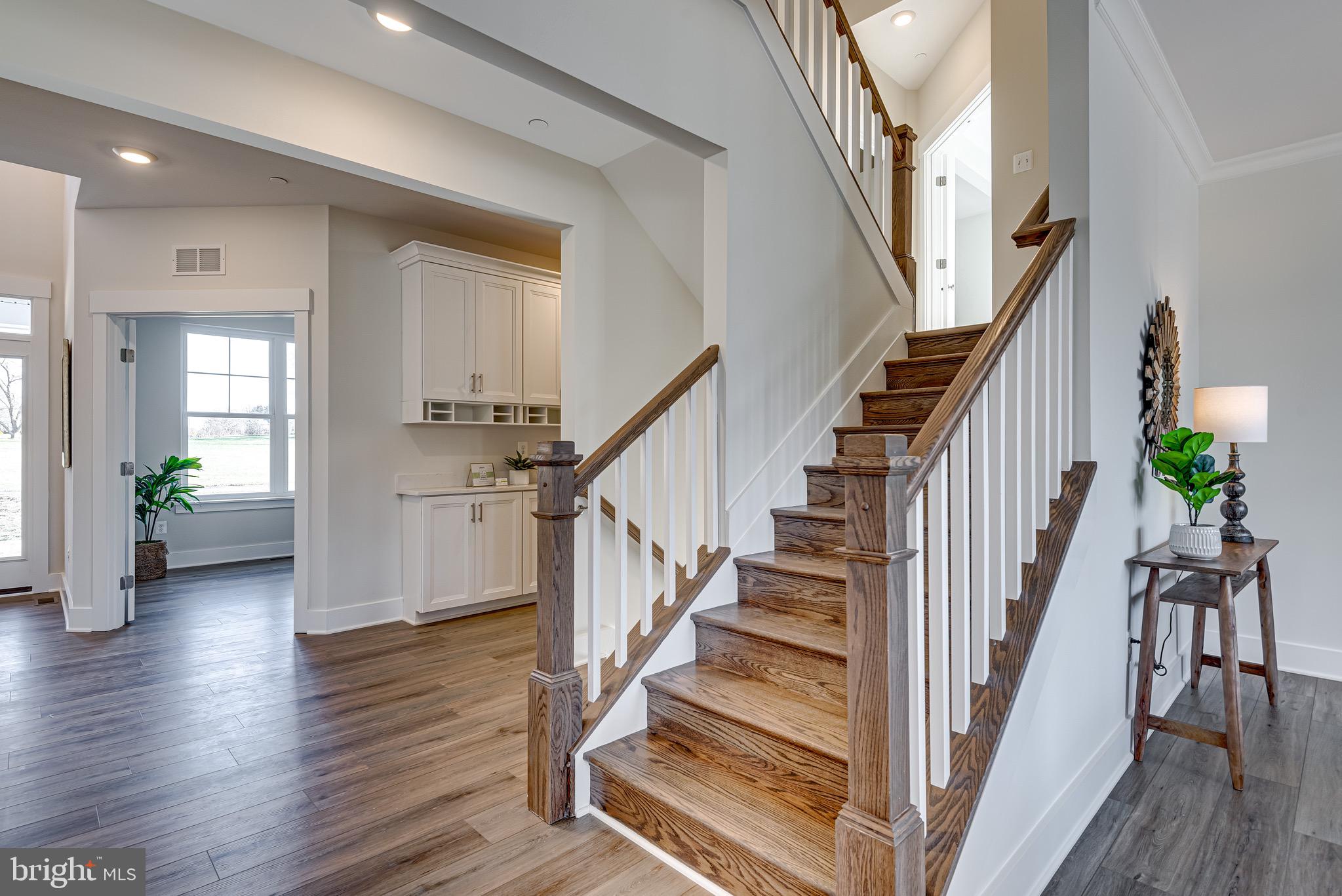 1337 German Driveway Hanover, MD 21076 - Photo 24 of 51 a view of staircase with wooden floor and a potted plant