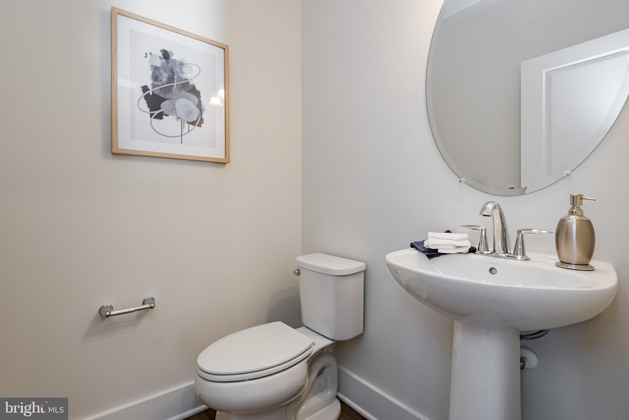 1337 German Driveway Hanover, MD 21076 - Photo 25 of 51 a bathroom with a toilet sink and mirror