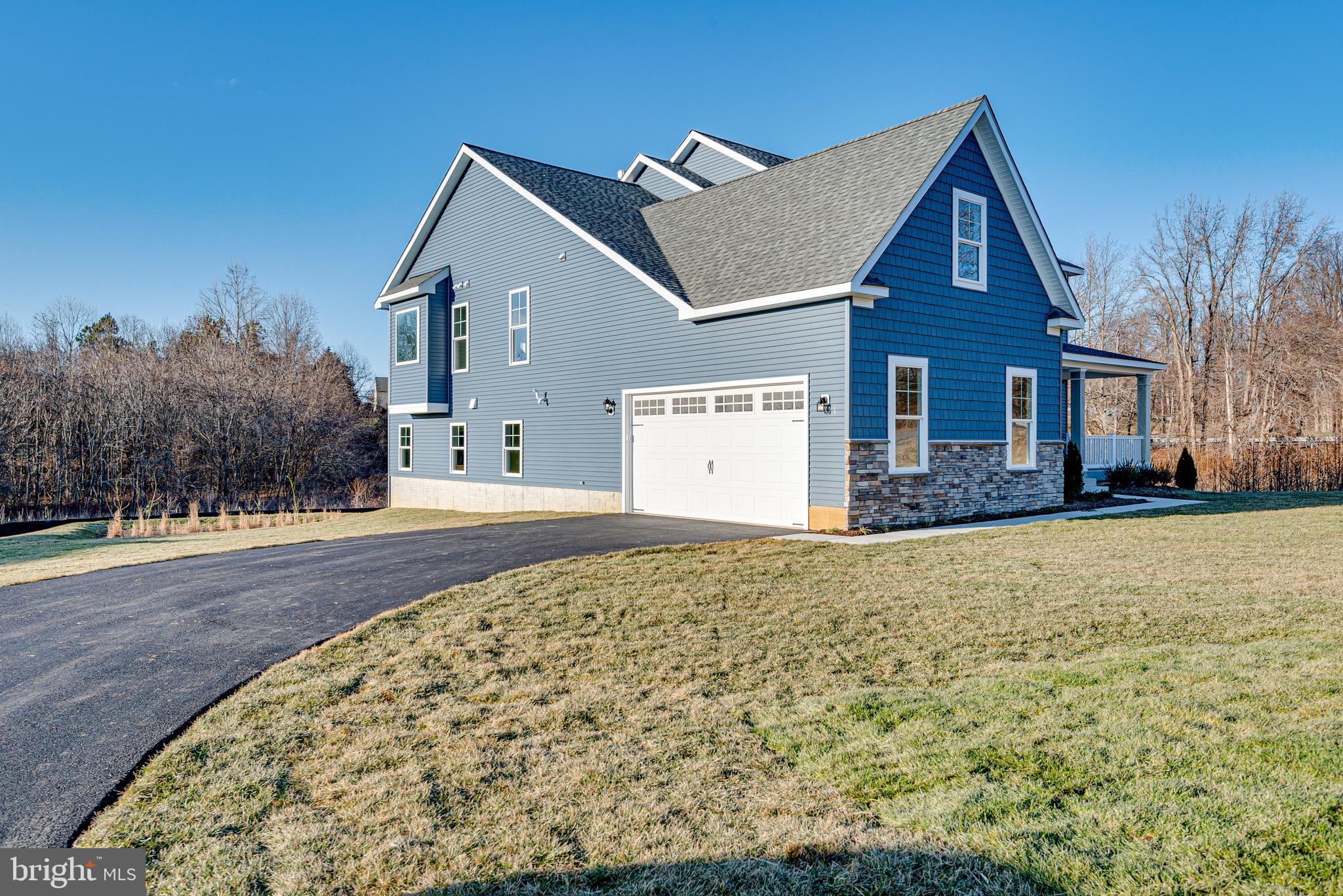 1337 German Driveway Hanover, MD 21076 - Photo 4 of 51 a front view of a house with a yard