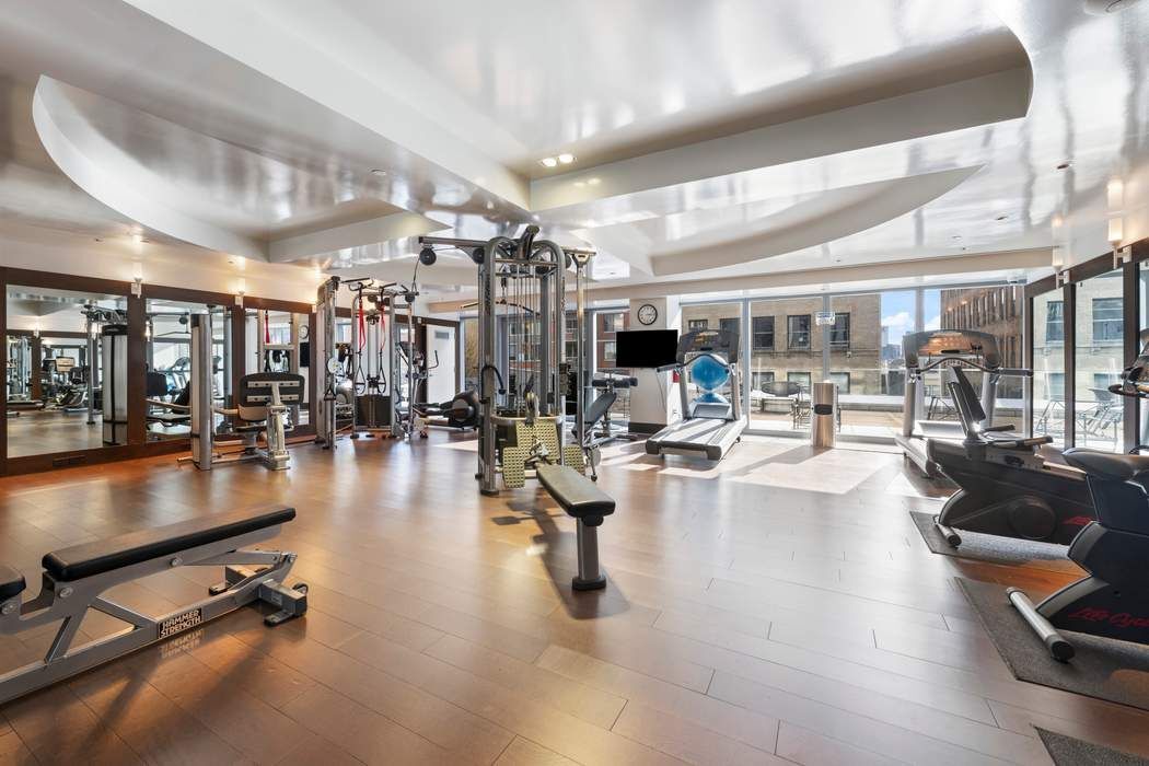 35 West 15th Street, Unit 13B Manhattan, NY 10011 - Photo 6 of 10 a gym room with lots of gym equipment