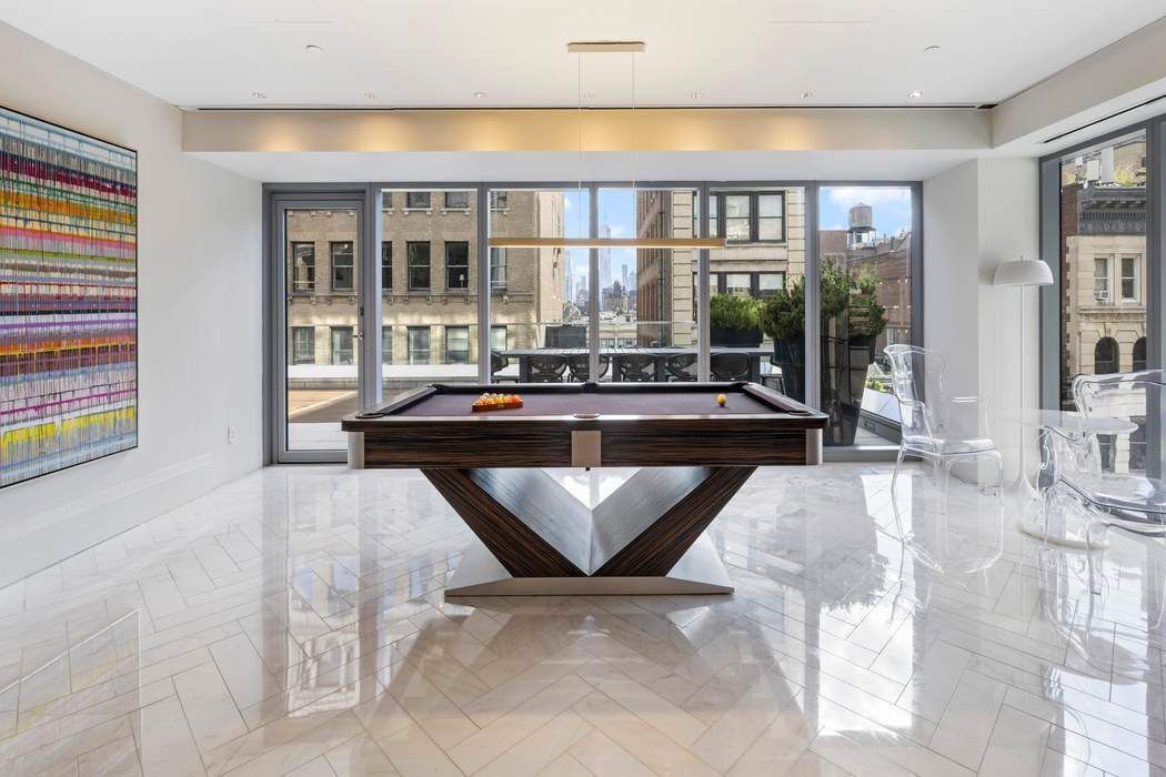 35 West 15th Street, Unit 13B Manhattan, NY 10011 - Photo 7 of 10 a living room with furniture and large window