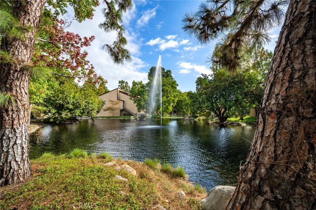 7890 East Spring Street, Unit 4W Long Beach, CA 90815 - Photo 2 of 36 a view of a lake with houses