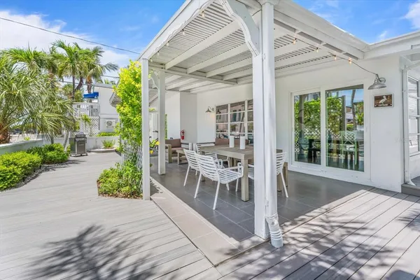a outdoor space with a large window and furniture