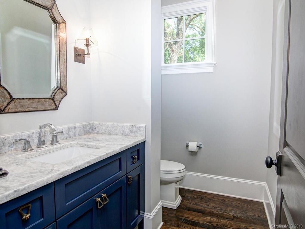 6237 Sharon Acres Road Charlotte, NC 28210 - Photo 16 of 48 a bathroom with a granite countertop sink toilet and shower
