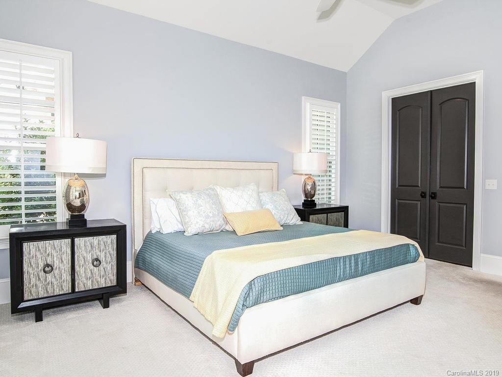 6237 Sharon Acres Road Charlotte, NC 28210 - Photo 18 of 48 a bedroom with a bed and a night stand