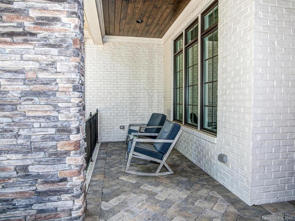 6237 Sharon Acres Road Charlotte, NC 28210 - Photo 3 of 48 a view of a patio with a table and chair