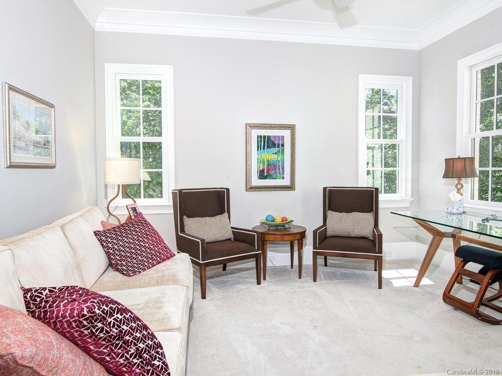 6237 Sharon Acres Road Charlotte, NC 28210 - Photo 23 of 48 a bedroom with furniture and a window