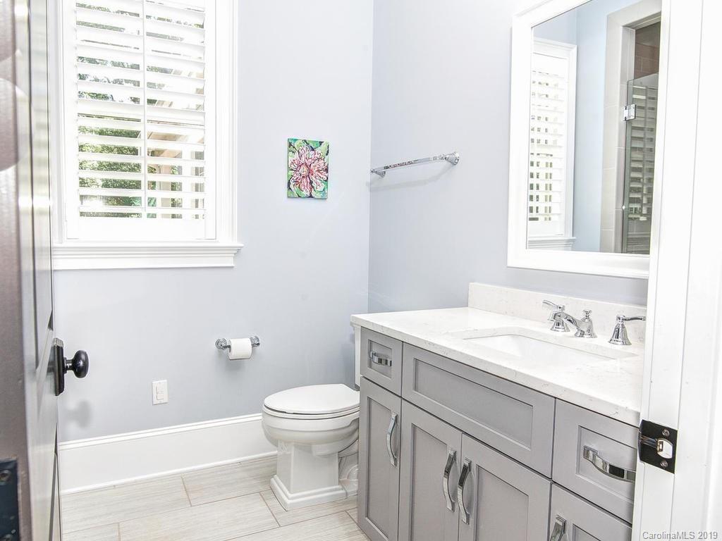 6237 Sharon Acres Road Charlotte, NC 28210 - Photo 25 of 48 a bathroom with a sink a toilet and a bathtub