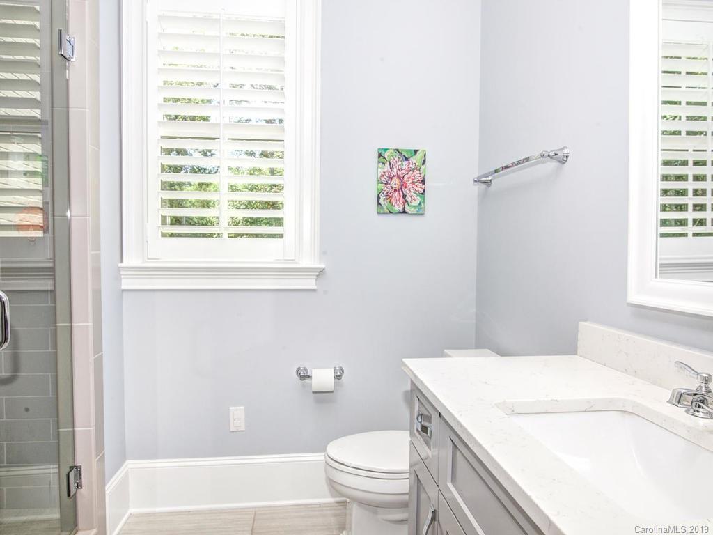 6237 Sharon Acres Road Charlotte, NC 28210 - Photo 26 of 48 a bathroom with a sink a toilet and a bathtub