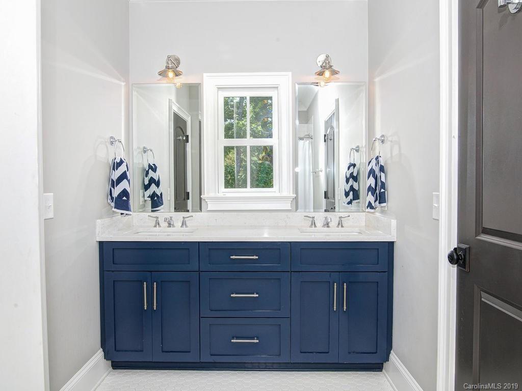 6237 Sharon Acres Road Charlotte, NC 28210 - Photo 28 of 48 a bathroom with a granite countertop sink and a window