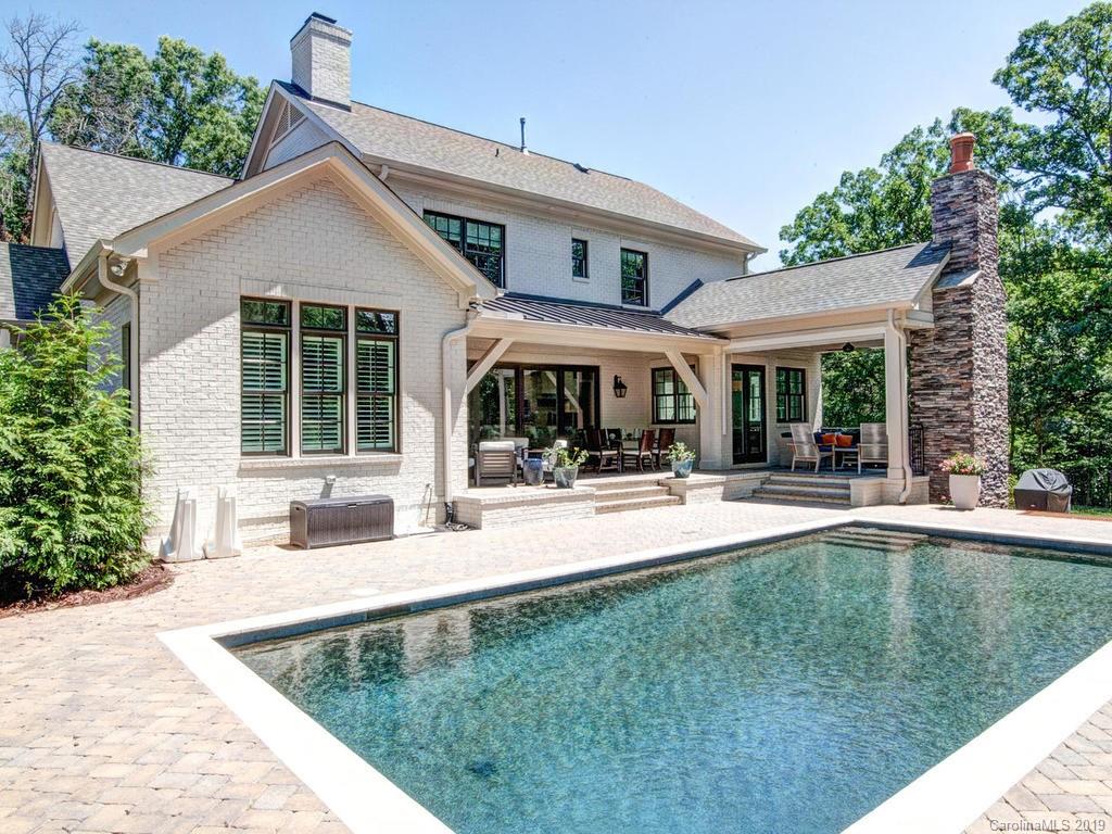 6237 Sharon Acres Road Charlotte, NC 28210 - Photo 46 of 48 a view of a house with swimming pool and sitting area