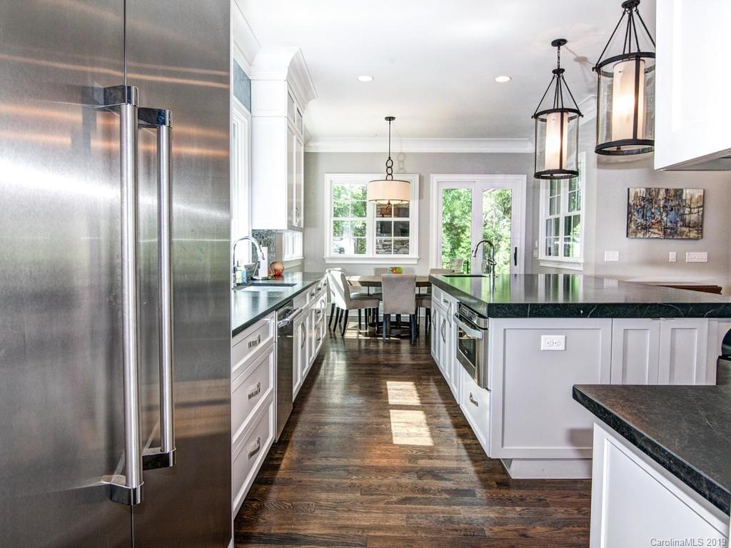 6237 Sharon Acres Road Charlotte, NC 28210 - Photo 9 of 48 a kitchen with stainless steel appliances granite countertop a refrigerator a stove and a sink