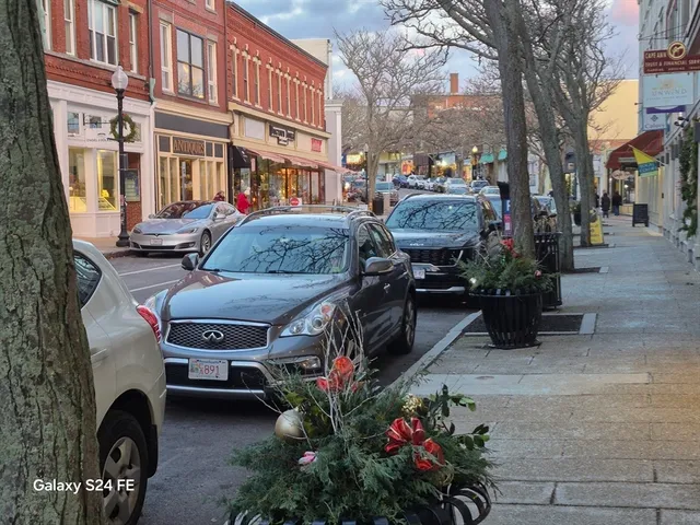 a couple of cars parked in front of buildings
