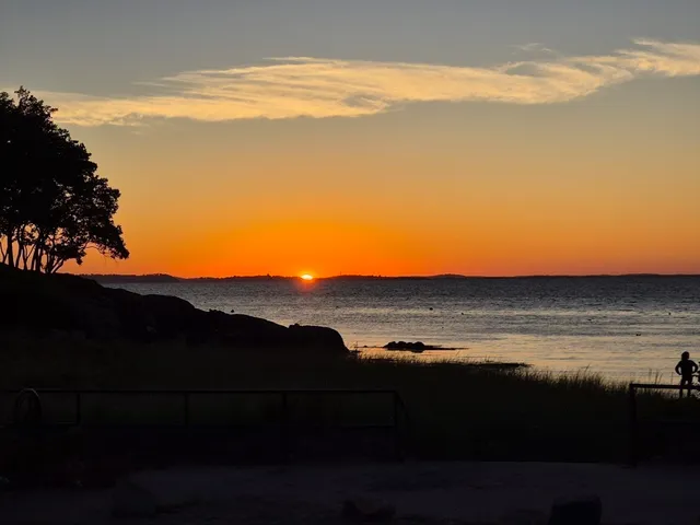 a view of an ocean and a mountain