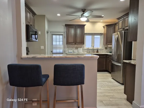 a view of a house with a bench