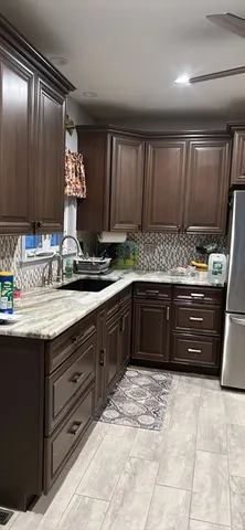 a kitchen with a sink and cabinets