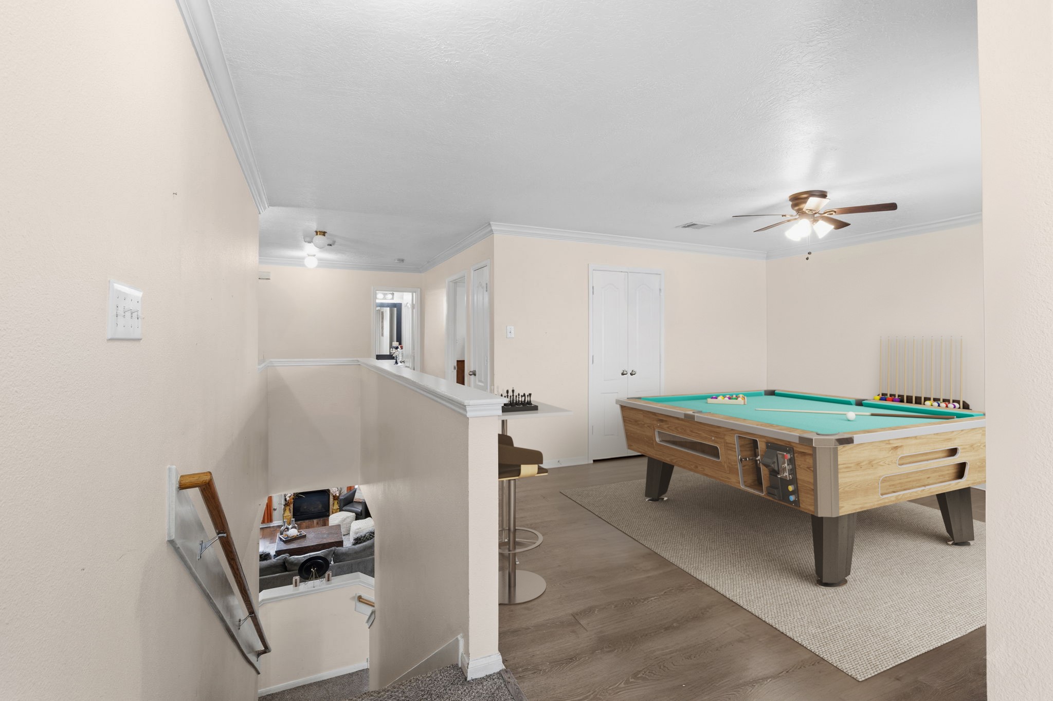 1319 Collier Point Lane Fresno, TX 77545 - Photo 21 of 33 Virtually Staged: The bright and airy loft area overlooks the staircase and creates a versatile space ideal for a media room, home office, or entertainment area.