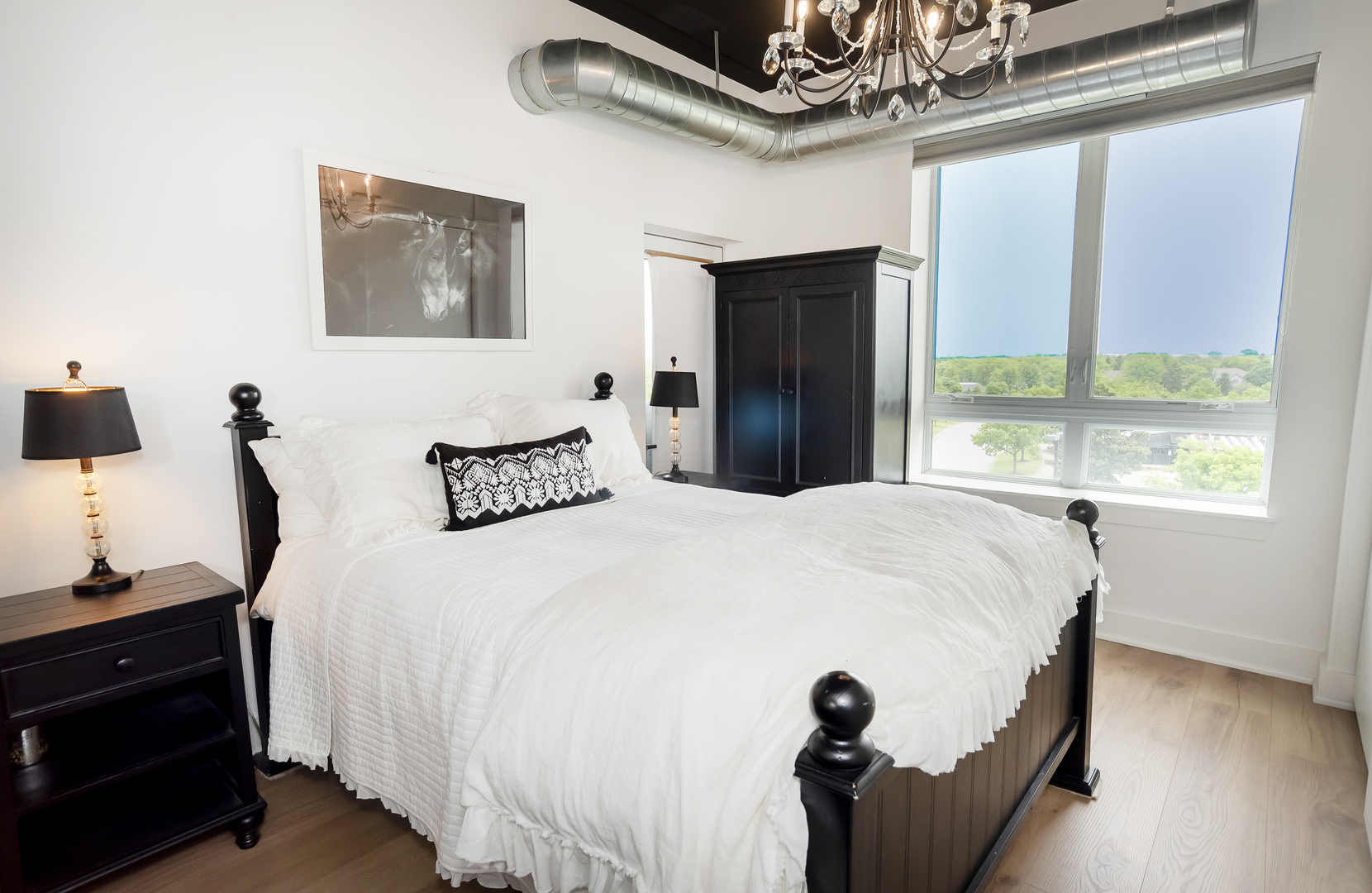 450 Village Center Drive, Unit 315 Burr Ridge, IL 60527 - Photo 14 of 21 a bedroom with a bed and a window