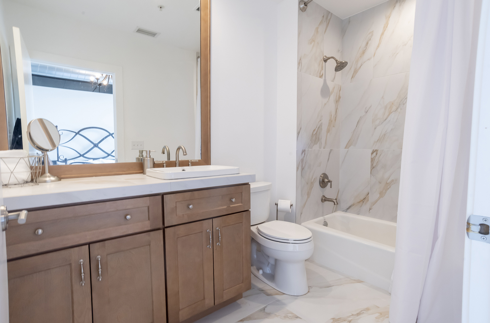 450 Village Center Drive, Unit 315 Burr Ridge, IL 60527 - Photo 19 of 21 a bathroom with a sink toilet and shower