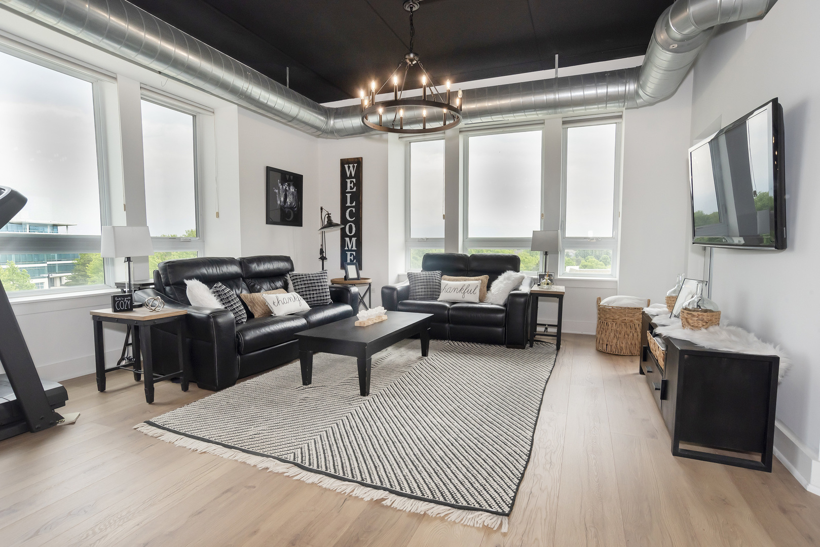 450 Village Center Drive, Unit 315 Burr Ridge, IL 60527 - Photo 9 of 21 a living room with furniture and a large window