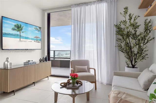 a view of a workspace with furniture and a gate