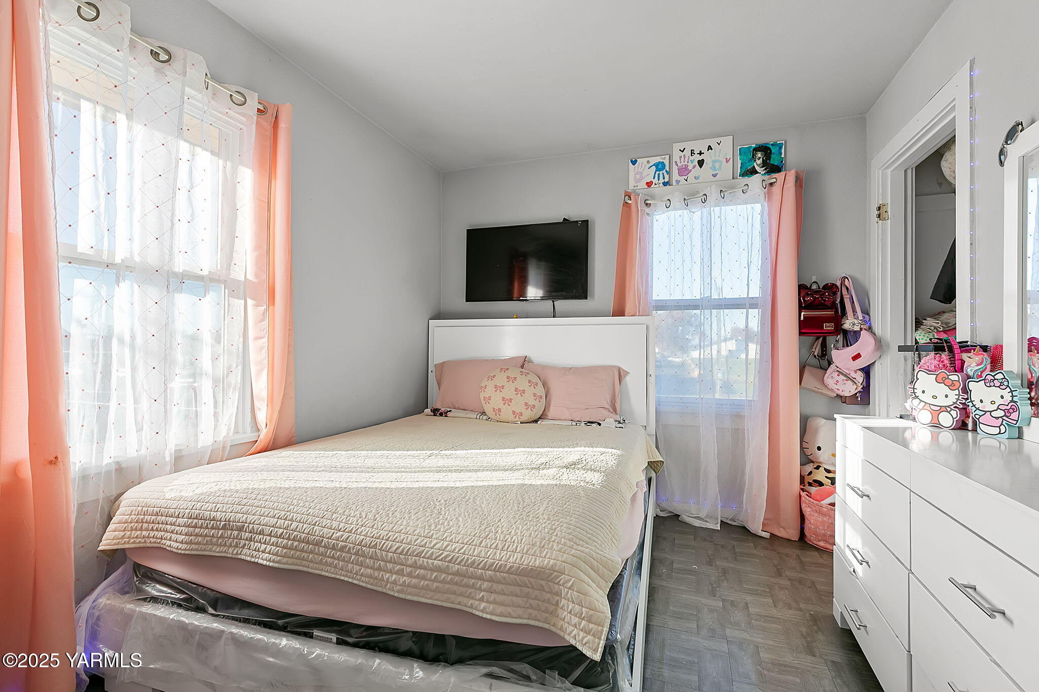 419 West 3rd Street Wapato, WA 98951 - Photo 14 of 19 a bedroom with a bed and a flat screen tv