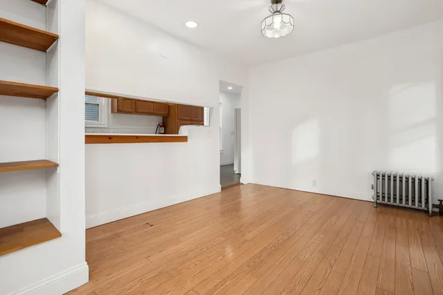 a view of a livingroom with wooden floor