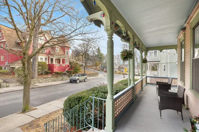 a glass building with sign on the side of it