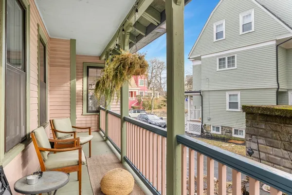 a view of balcony with furniture