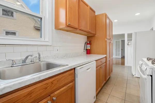 a kitchen with a sink and cabinets