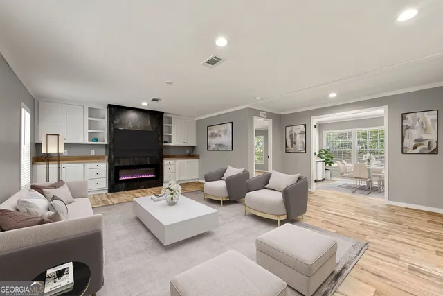 a living room with furniture and a flat screen tv